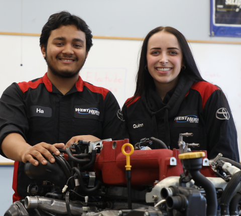 Two students smiling at camera