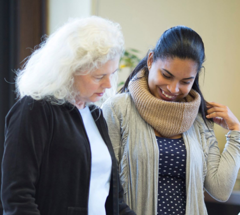 Student and teacher reviewing work