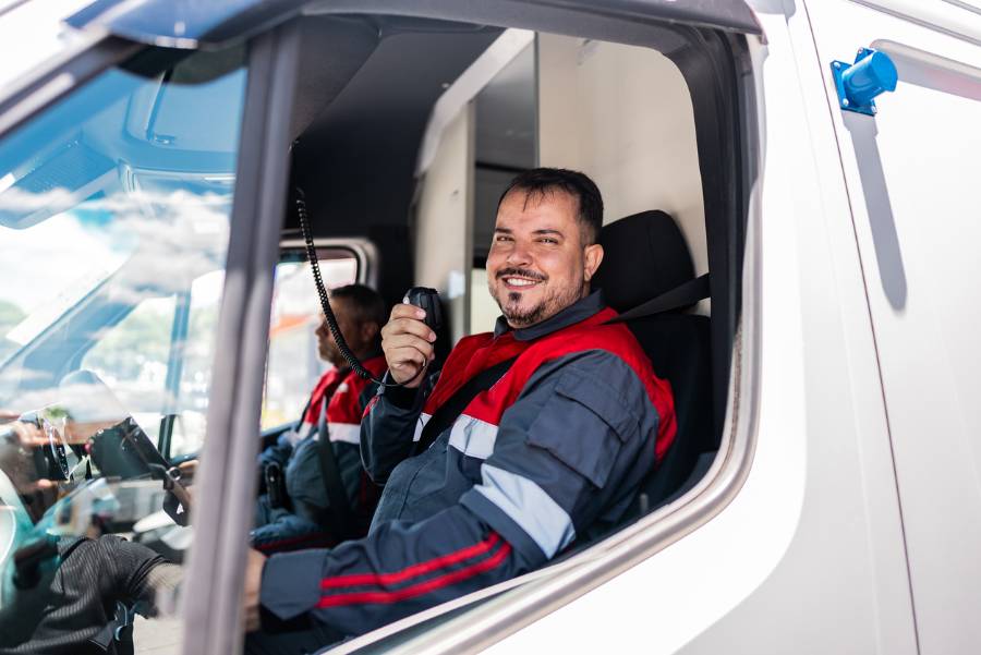Portrait of a rescue worker man driving an ambulance