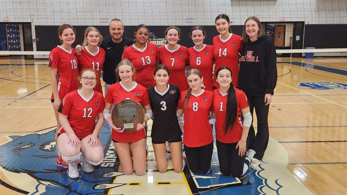 Women's Volleyball team photo holding runner up award